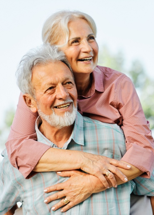 Happy active senior couple having fun outdoors