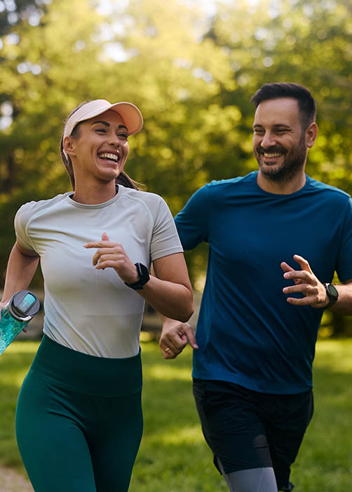Happy young couple exercising together after bioidentical hormone replacement therapy