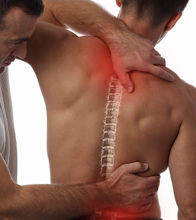 Man getting chiropractic care for lower and upper back pain.