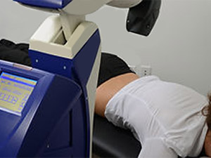 Class IV laser being used as part of MLS Laser Therapy at Summit Health Group