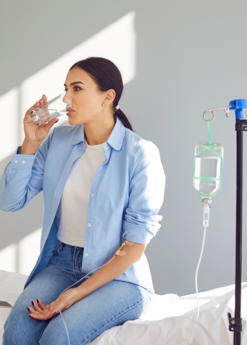 woman receiving iv infusion therapy