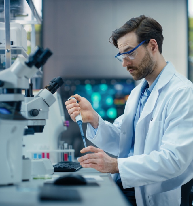 Young Male Scientist Working with Samples
